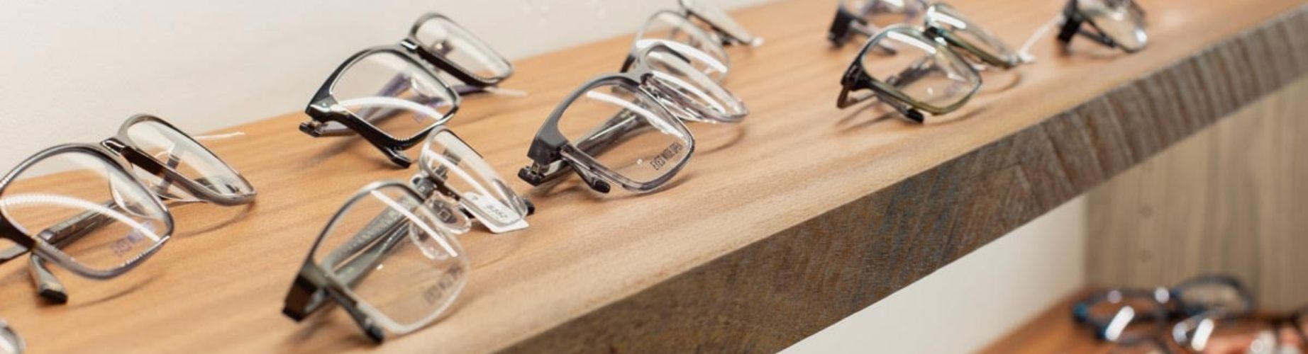 prescription glasses on a shelf